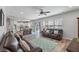 Open floorplan with hardwood floors, comfortable seating, dining area, and a bright and airy atmosphere at 210 Witch Hazel St, Summerville, SC 29486