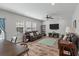 Bright and airy living room with hardwood floors, comfortable seating, and a ceiling fan at 210 Witch Hazel St, Summerville, SC 29486