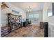 Hard-floored office features an office desk, shelving and a chandelier at 210 Witch Hazel St, Summerville, SC 29486
