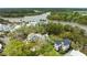 Stunning aerial view of waterfront homes with lush trees and pristine river views, showcasing luxury living at 2138 Boatwright Rd, Johns Island, SC 29455