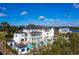 Stunning aerial view of the luxury home, pool and well manicured grounds on the water at 2138 Boatwright Rd, Johns Island, SC 29455