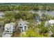 Scenic aerial view of the home nestled among lush trees and a serene river at 2138 Boatwright Rd, Johns Island, SC 29455