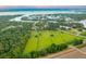 Expansive aerial view of a property featuring lush green fields and surrounding woodlands at 2138 Boatwright Rd, Johns Island, SC 29455