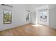 Bright bedroom with hardwood floors and multiple windows providing ample natural light at 2138 Boatwright Rd, Johns Island, SC 29455