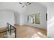 Bonus room with hardwood floors, black window frames, and bright lighting at 2138 Boatwright Rd, Johns Island, SC 29455