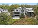 Beautiful home exterior featuring a covered patio with a water feature and lush greenery, perfect for relaxation at 2138 Boatwright Rd, Johns Island, SC 29455
