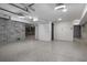 Spacious garage with concrete block walls and epoxy flooring providing an industrial aesthetic at 2138 Boatwright Rd, Johns Island, SC 29455