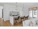 Stylish kitchen with marble island, pendant lights, and seating for guests at 2138 Boatwright Rd, Johns Island, SC 29455
