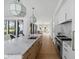 Kitchen features a marble island, designer lighting, modern appliances, and an open floor plan at 2138 Boatwright Rd, Johns Island, SC 29455