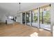 Bright living area with large sliding doors to a covered patio and open kitchen view at 2138 Boatwright Rd, Johns Island, SC 29455