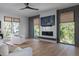Cozy living room with large windows, fireplace, and comfortable seating at 2138 Boatwright Rd, Johns Island, SC 29455