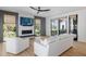 Bright living area with floor-to-ceiling windows and a view to the backyard at 2138 Boatwright Rd, Johns Island, SC 29455