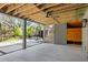Covered patio features a modern design with wood ceiling, outdoor kitchen, and stone fountain at 2138 Boatwright Rd, Johns Island, SC 29455