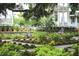 Scenic street view with residents biking near beautiful homes and lush landscaping at 2138 Boatwright Rd, Johns Island, SC 29455