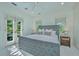 Sun-filled bedroom with plush carpeting, neutral decor and French doors leading to outside at 22 Fairhope Rd, Mount Pleasant, SC 29464