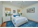 Comfortable bedroom with a queen-sized bed, blue rug, and modern decor for a relaxing retreat at 22 Fairhope Rd, Mount Pleasant, SC 29464
