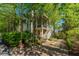 Beautiful two-story home with lush landscaping and a brick driveway at 22 Fairhope Rd, Mount Pleasant, SC 29464