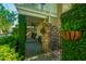 View of wrought iron gate and lush landscaping leading to the home's entrance at 22 Fairhope Rd, Mount Pleasant, SC 29464