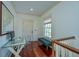 Upstairs landing space with desk, chair, and natural light from window at 22 Fairhope Rd, Mount Pleasant, SC 29464