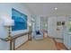 Bright hallway with wood floors, accent furniture, decor, and an open view of the kitchen at 22 Fairhope Rd, Mount Pleasant, SC 29464