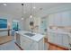 Bright kitchen showcasing white cabinets, stainless appliances, and a functional kitchen island at 22 Fairhope Rd, Mount Pleasant, SC 29464