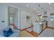 A modern kitchen featuring stainless steel appliances, white cabinets, and an island with sink at 22 Fairhope Rd, Mount Pleasant, SC 29464