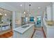 An open kitchen features an island with sink, modern appliances, and convenient access to dining at 22 Fairhope Rd, Mount Pleasant, SC 29464