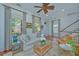 Open-concept living room with fireplace and hardwood floors at 22 Fairhope Rd, Mount Pleasant, SC 29464