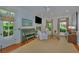Cozy living room with fireplace, piano, and hardwood floors at 22 Fairhope Rd, Mount Pleasant, SC 29464