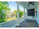 Covered porch featuring large columns, ceiling fan and scenic neighborhood views at 22 Fairhope Rd, Mount Pleasant, SC 29464