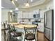 Bright kitchen features stainless steel appliances, granite countertops, and breakfast bar with seating at 222 Stone Village Cir, Summerville, SC 29486