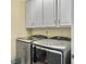Functional laundry room featuring modern gray cabinets and appliances at 222 Stone Village Cir, Summerville, SC 29486