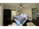 Cozy bedroom with a ceiling fan, dark hardwood floors, and a queen-sized bed at 238 Howle Ave, Charleston, SC 29412