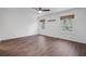 Bright, airy bedroom showcasing hardwood floors, neutral walls, and natural light from two windows at 238 Howle Ave, Charleston, SC 29412