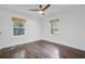 Bright bedroom featuring hardwood floors, a modern ceiling fan, and white trim throughout at 238 Howle Ave, Charleston, SC 29412
