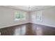 Bright bedroom with hardwood floors, large windows, neutral colors and modern ceiling fan at 238 Howle Ave, Charleston, SC 29412