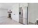 Spacious kitchen features stainless appliances, white cabinets, and a brick fireplace in the adjacent area at 238 Howle Ave, Charleston, SC 29412
