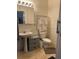 Simple bathroom with pedestal sink, vanity mirror and tile flooring at 241 Germantown Rd, Summerville, SC 29483