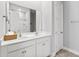 Bright bathroom featuring double sink vanity, large mirror, and separate shower area at 245 Ribbon Rd, Summerville, SC 29483