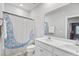 Bathroom with double vanity and mermaid-themed shower curtain at 245 Ribbon Rd, Summerville, SC 29483