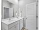 Bright bathroom features a double sink vanity and framed mirror at 245 Ribbon Rd, Summerville, SC 29483
