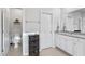 Well-lit bathroom with granite counters, double sinks, a toilet and a laundry bin at 245 Ribbon Rd, Summerville, SC 29483