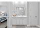 Bathroom featuring double sinks and marble countertops, along with a view into a bedroom at 245 Ribbon Rd, Summerville, SC 29483