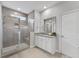 Bright bathroom featuring a tiled shower with a glass door, granite countertop, and neutral tile flooring at 245 Ribbon Rd, Summerville, SC 29483