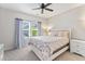 Charming bedroom with a fan, a window with curtains, and a white nightstand at 245 Ribbon Rd, Summerville, SC 29483