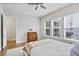 Bright bedroom with ceiling fan featuring neutral colors, wooden desk and inviting natural light at 245 Ribbon Rd, Summerville, SC 29483