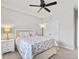 Bedroom featuring rainbow-themed bedding, a ceiling fan, and a window with curtains at 245 Ribbon Rd, Summerville, SC 29483