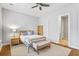 Serene bedroom features neutral tones, with ceiling fan, bench and inviting natural light at 245 Ribbon Rd, Summerville, SC 29483