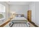 Comfortable bedroom with natural light, stylish furniture, soft textiles and a wooden bookshelf at 245 Ribbon Rd, Summerville, SC 29483