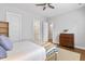 Charming bedroom features neutral color palette, vintage writing desk, ceiling fan, and soft textiles at 245 Ribbon Rd, Summerville, SC 29483